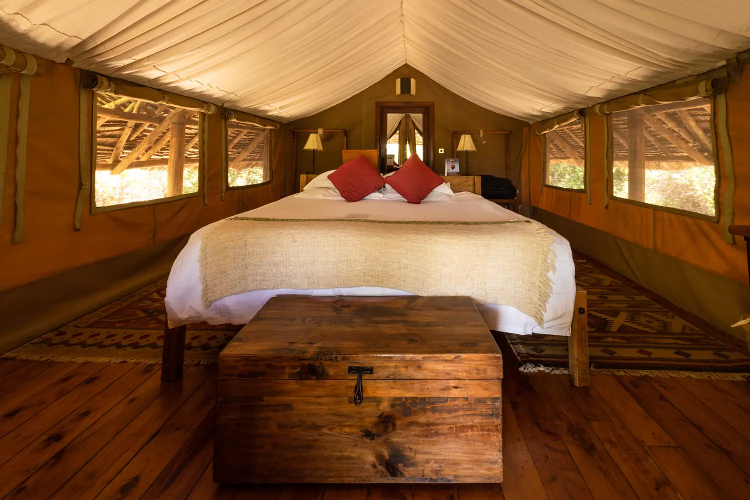 A lodge room open to the plains, with Kilimanjaro beyond